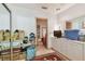 Functional storage room with a mirror wall, plenty of shelving, and easy access to other rooms at 8510 Lays Cove Pl, Odessa, FL 33556