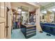 Organized walk-in closet features ample storage and an island with drawers and a blue countertop at 8510 Lays Cove Pl, Odessa, FL 33556