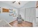 Bedroom featuring a window, light blue walls, and wood-look floors at 11338 Stratton Park Dr # 11338, Temple Terrace, FL 33617