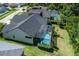 An aerial view shows the pool area in the home's fenced and private backyard at 12906 Tar Flower Dr, Tampa, FL 33626