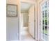 Well-lit bathroom with neutral tones, a shower-tub combo, and access to the backyard at 12906 Tar Flower Dr, Tampa, FL 33626