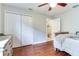 Bright bedroom with hardwood floors, closet and access to en suite bath at 12906 Tar Flower Dr, Tampa, FL 33626