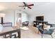 Spacious bonus room featuring carpet floors, a ceiling fan and a television set at 12906 Tar Flower Dr, Tampa, FL 33626