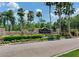 The Westwood Lakes neighborhood has a decorative entrance sign with beautiful landscaping, shrubbery, and lighting at 12906 Tar Flower Dr, Tampa, FL 33626