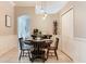 Charming dining area with stylish lighting and a convenient wine rack at 12906 Tar Flower Dr, Tampa, FL 33626