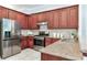 Well-equipped kitchen features stainless steel appliances, granite countertops, and ample cabinet space at 12906 Tar Flower Dr, Tampa, FL 33626