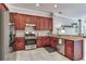 Kitchen features modern appliances, ample cabinets, and a view to the living area at 12906 Tar Flower Dr, Tampa, FL 33626
