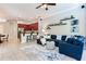Open-concept living room featuring a modern kitchen with stainless steel appliances and a breakfast bar at 12906 Tar Flower Dr, Tampa, FL 33626