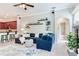 Cozy living room with an open floor plan, flowing seamlessly to the kitchen and bathroom areas at 12906 Tar Flower Dr, Tampa, FL 33626
