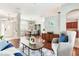 Spacious open-plan living and dining area with hardwood floors and lots of natural light at 12906 Tar Flower Dr, Tampa, FL 33626