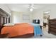 Bedroom featuring carpeted floors, ceiling fan, and an entrance to living room at 1730 Sunset Point Rd, Clearwater, FL 33755