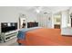 Bedroom with a ceiling fan, large closet, and access to an ensuite bathroom at 1730 Sunset Point Rd, Clearwater, FL 33755