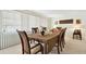 Elegant dining room with a wooden table and chairs, perfect for entertaining at 1730 Sunset Point Rd, Clearwater, FL 33755