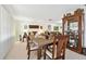 Elegant dining room with a wooden table, chairs, and a china cabinet at 1730 Sunset Point Rd, Clearwater, FL 33755