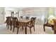 Elegant dining room with a wooden table and chairs, and plenty of natural light at 1730 Sunset Point Rd, Clearwater, FL 33755