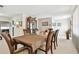 Elegant dining room with a wooden table, chairs, and a china cabinet at 1730 Sunset Point Rd, Clearwater, FL 33755