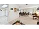 Neutral dining room with table, chairs, and view of living room and kitchen at 1730 Sunset Point Rd, Clearwater, FL 33755
