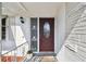 Elegant front door featuring an oval glass insert and decorative accents at 1730 Sunset Point Rd, Clearwater, FL 33755
