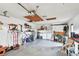 Organized garage interior including washer/dryer and space for utility and storage at 1730 Sunset Point Rd, Clearwater, FL 33755