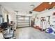 Well-lit garage with an automatic door, offering storage space and a workbench area at 1730 Sunset Point Rd, Clearwater, FL 33755
