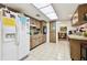 Spacious kitchen with modern appliances, white refrigerator and plenty of counter space at 1730 Sunset Point Rd, Clearwater, FL 33755