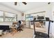 Multi-purpose room with natural light, a treadmill, and a view to living room at 1730 Sunset Point Rd, Clearwater, FL 33755