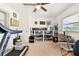 Bright office area with a window, treadmill, and ample storage at 1730 Sunset Point Rd, Clearwater, FL 33755