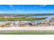 Stunning aerial view of a beachfront condo community with beautiful views of the beach, river, and ocean at 18304 Gulf Blvd # 217, Redington Shores, FL 33708