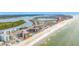 Aerial view of condo building near the beach, with a waterway in the distance at 18304 Gulf Blvd # 217, Redington Shores, FL 33708