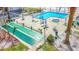 Outdoor amenities feature a community pool, hot tub, shuffleboard, lounging chairs, and tables under blue umbrellas at 18304 Gulf Blvd # 217, Redington Shores, FL 33708