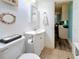 Bathroom with white vanity, seashell decor, and tile flooring at 18304 Gulf Blvd # 217, Redington Shores, FL 33708