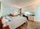 Bright bedroom with laminate floors, ample storage, and a window providing natural light and relaxing ambience at 18304 Gulf Blvd # 217, Redington Shores, FL 33708