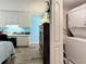 Bedroom and laundry room; ample storage, natural light, and convenient in-unit laundry facilities at 18304 Gulf Blvd # 217, Redington Shores, FL 33708