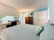 Bright bedroom with desk and antique furnishings; comfortable and stylish at 18304 Gulf Blvd # 217, Redington Shores, FL 33708