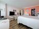 Serene bedroom with wooden floors and a view of the closet at 18304 Gulf Blvd # 217, Redington Shores, FL 33708