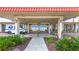 Community entrance showcasing a lush garden and Gulf of Mexico views. You can see the USPS delivery truck outside at 18304 Gulf Blvd # 217, Redington Shores, FL 33708