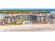 Aerial view of the condo building near the beach, showcasing the balconies and ocean view at 18304 Gulf Blvd # 217, Redington Shores, FL 33708