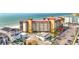 Exterior view of condominium with ample parking, beautiful landscaping, and Gulf of Mexico beaches in the background at 18304 Gulf Blvd # 217, Redington Shores, FL 33708
