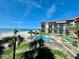 Beautiful condo building with a pool, shuffleboard, and a direct view of the beach and ocean at 18304 Gulf Blvd # 217, Redington Shores, FL 33708
