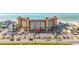 Exterior of the condo with a large parking lot and beautiful Gulf of Mexico beaches across the street at 18304 Gulf Blvd # 217, Redington Shores, FL 33708