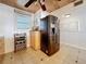Cozy kitchen features stainless steel appliances, wood ceiling, and a convenient wine rack at 18304 Gulf Blvd # 217, Redington Shores, FL 33708