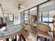 Enclosed lanai with tile flooring and furniture for outdoor relaxation and dining at 18304 Gulf Blvd # 217, Redington Shores, FL 33708