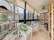 Enclosed lanai with tile flooring, patio furniture, and ocean views at 18304 Gulf Blvd # 217, Redington Shores, FL 33708