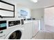 Well-maintained on-site laundry with multiple washers and dryers, a convenient amenity for residents at 18304 Gulf Blvd # 217, Redington Shores, FL 33708
