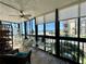Enclosed lanai area with tile flooring, shelving, and beautiful beach views at 18304 Gulf Blvd # 217, Redington Shores, FL 33708
