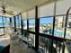 Enclosed lanai area with tile flooring, shelving, and beautiful beach views at 18304 Gulf Blvd # 217, Redington Shores, FL 33708
