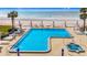 Enjoy a spacious community pool with Gulf views, tables, chairs, umbrellas and a hot tub at 18304 Gulf Blvd # 217, Redington Shores, FL 33708