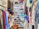 Organized walk-in closet with shelves and hanging rods for ample storage space at 18304 Gulf Blvd # 217, Redington Shores, FL 33708