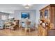 Inviting dining area with hardwood floors, adjacent to hutch and living room at 19029 Us Highway 19 N # 8-15, Clearwater, FL 33764