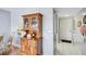 Interior hallway with hardwood floors and view into the kitchen at 19029 Us Highway 19 N # 8-15, Clearwater, FL 33764